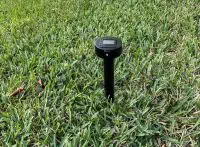 Smart Spider (R) Antenna staked on grassy ground